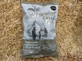 Two Farmers Crisps package on a straw background