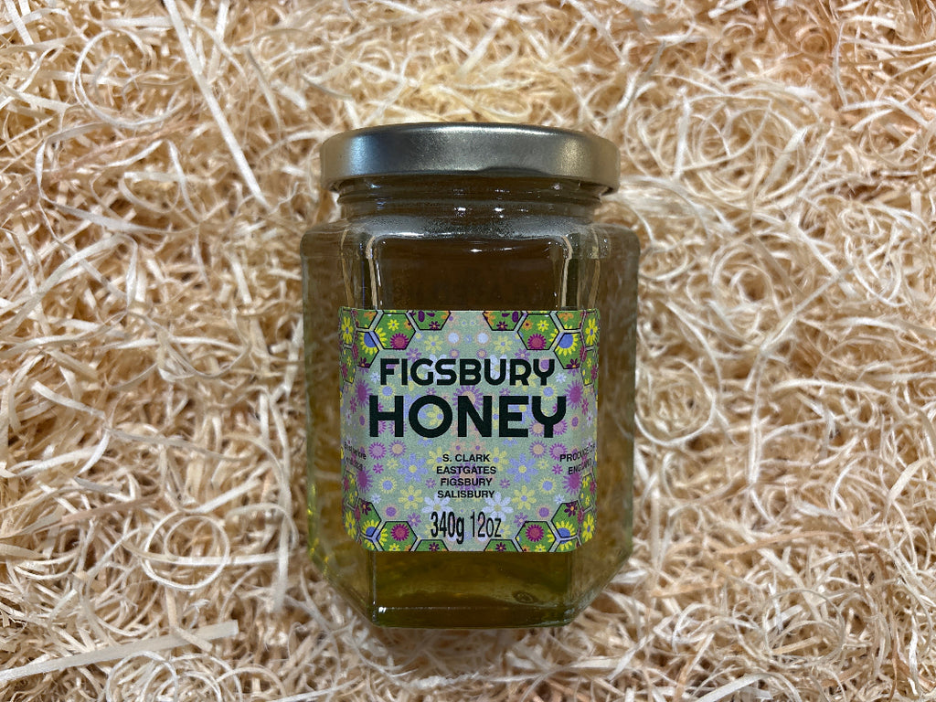 Jar of Figsbury Honey on a bed of straw