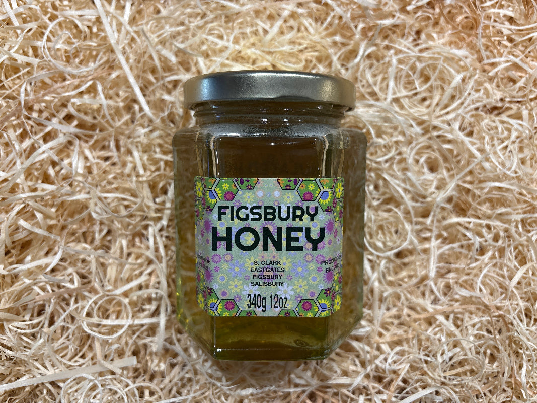 Jar of Figsbury Honey on a bed of straw