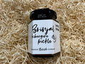 Jar of Brinjal Aubergine Pickle with relish on a bed of straw