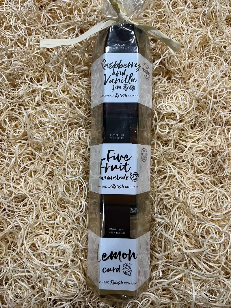 Bottle of Five Fruit lemon curd on a bed of straw