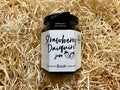 Jar of Strawberry Daiquiri jam from Harshhead Relish Company on a bed of straw.