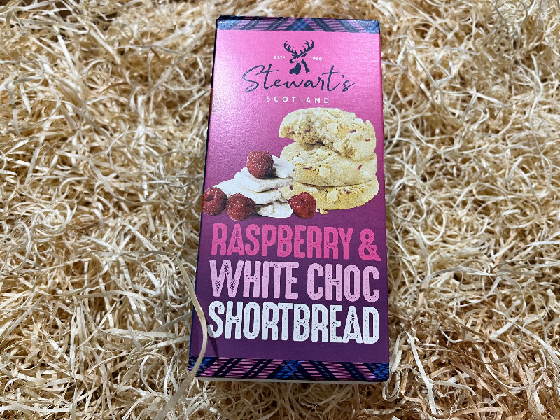 Packaging of Stewart's Raspberry & White Choc Shortbread on a straw background