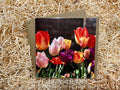 Greeting card with tulip design on a bed of straw
