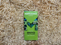 Montezuma's minted chocolate bar packaging on a textured surface