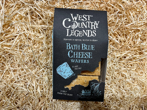 Packaging of West Country Legends Bath Blue Cheese Wafers on a straw background